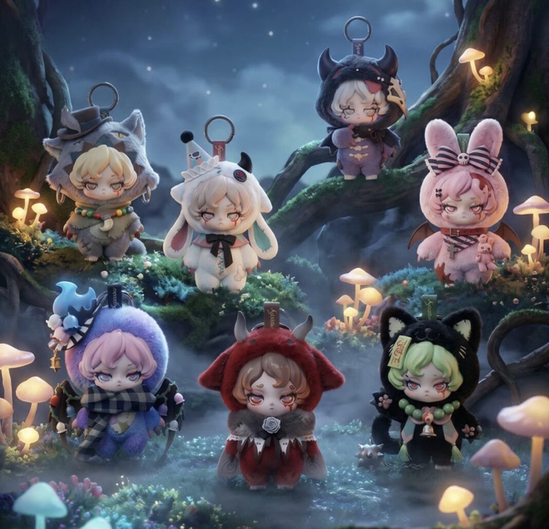 A dark, atmospheric fantasy studio photograph displaying seven different gothic plush figures from the Kynata 