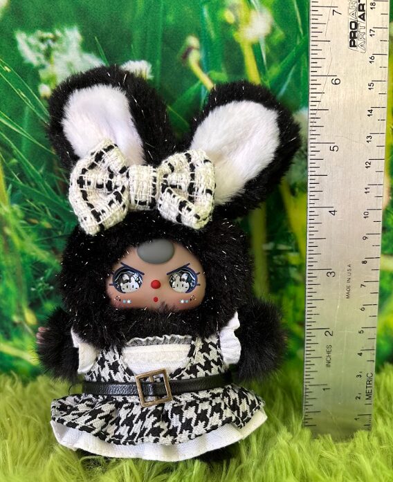 Front view of Baby Three Absolute Black and White series Star Twinkle bunny plush next to a ruler measuring 6 inches tall